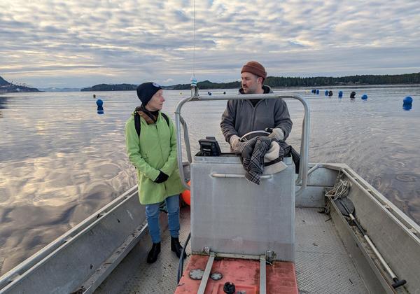 woman and man talking on a boat