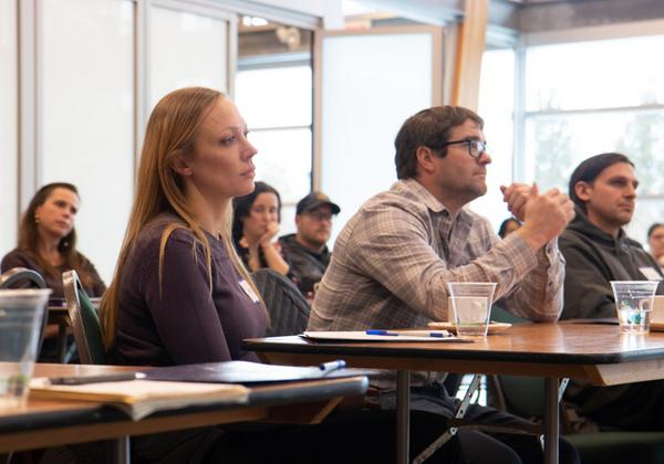 Entrepreneurs listening to a workshop presentation at Deep Bay