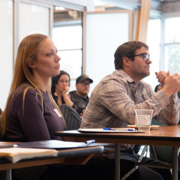 Entrepreneurs listening to a workshop presentation at Deep Bay